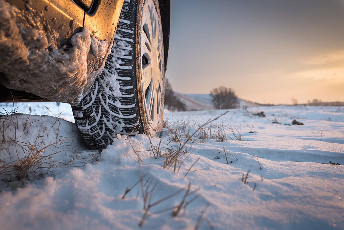 close up winter tire tread in the snow